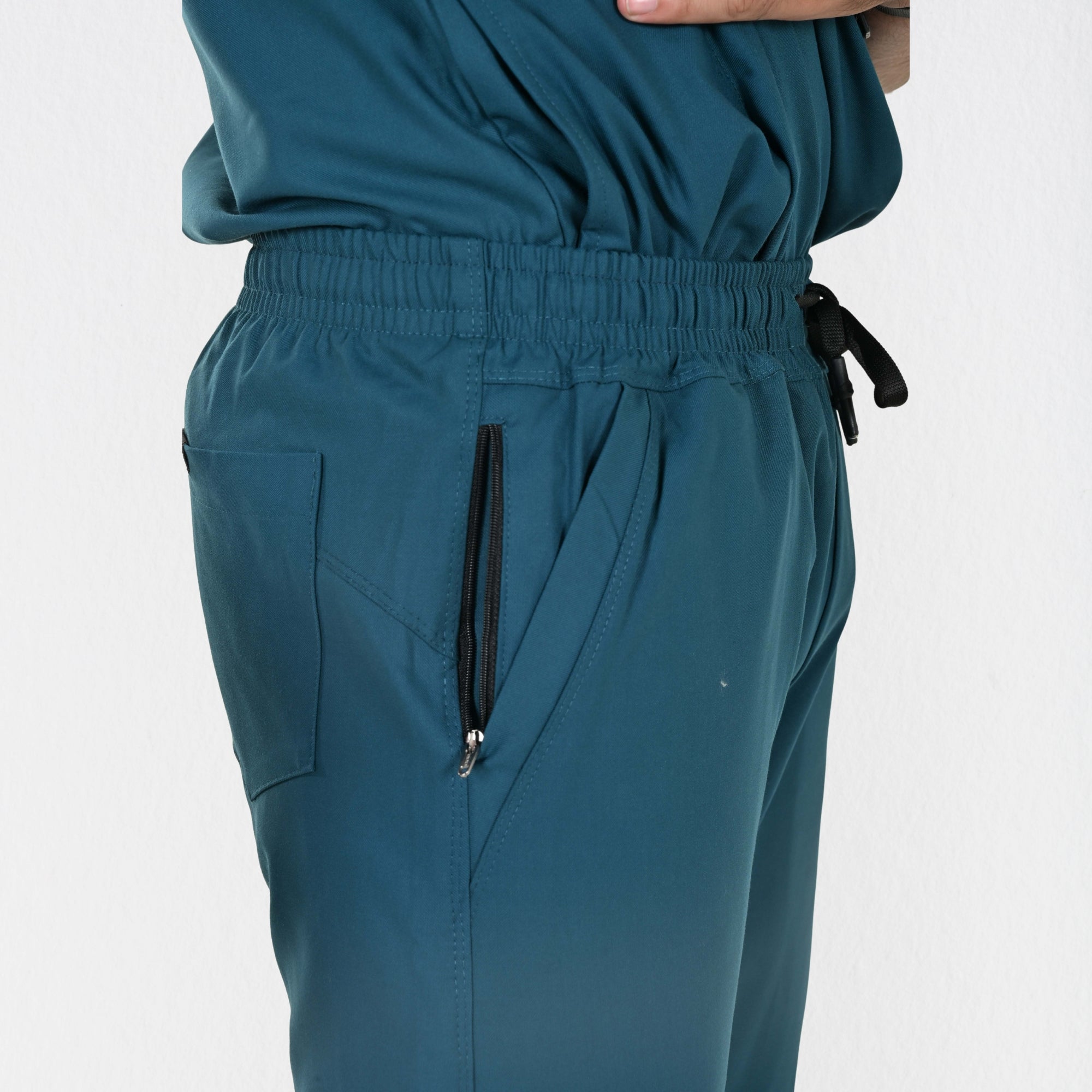 Alleda UltraFlex teal scrub fabric close-up — 60% Polyester 34% Rayon 6% Spandex moisture-wicking breathable medical scrub India