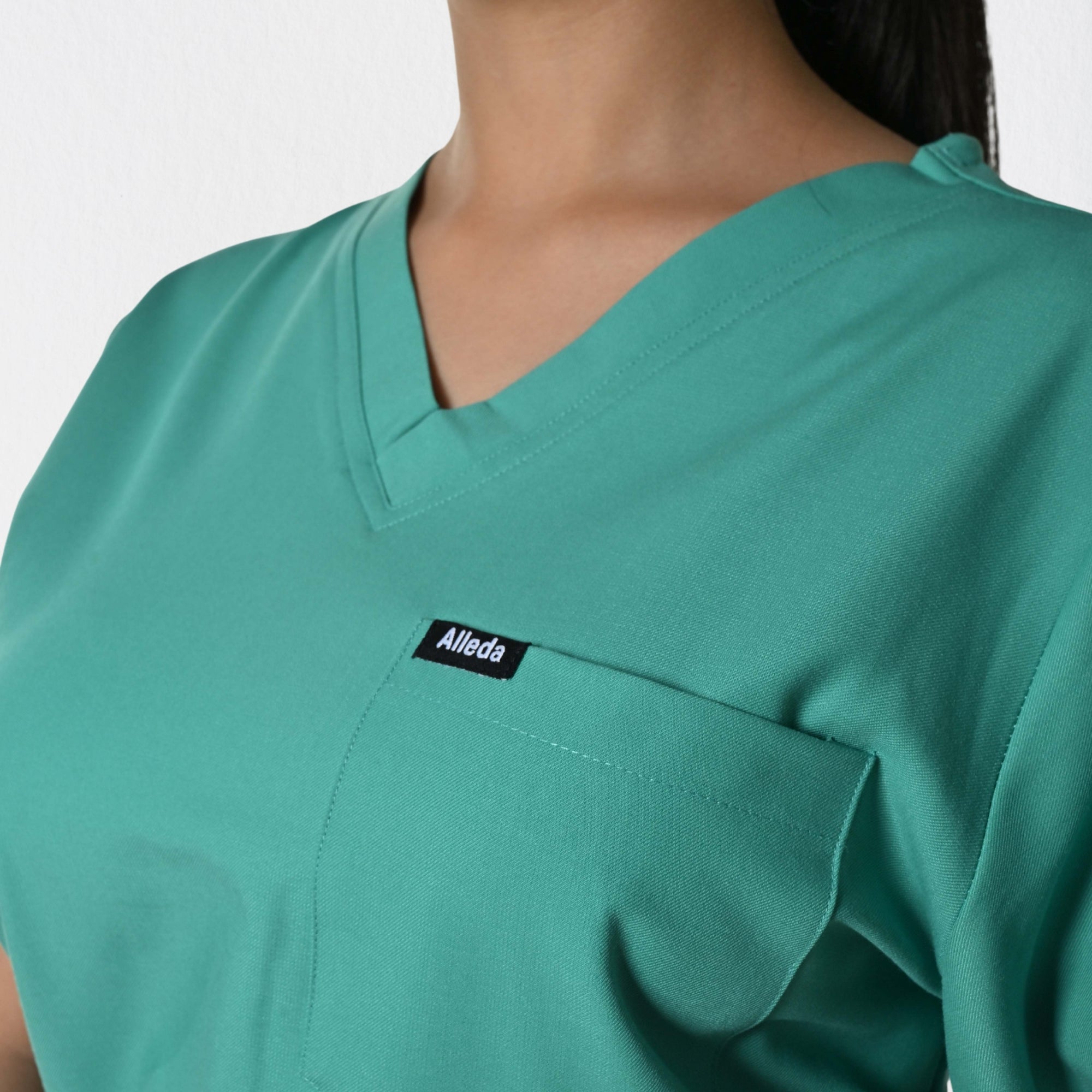Alleda UltraFlex women's surgical green scrub fabric close-up — 60% Polyester 34% Rayon 6% Spandex anti-pilling wash-stable women's OT clinical workwear India
