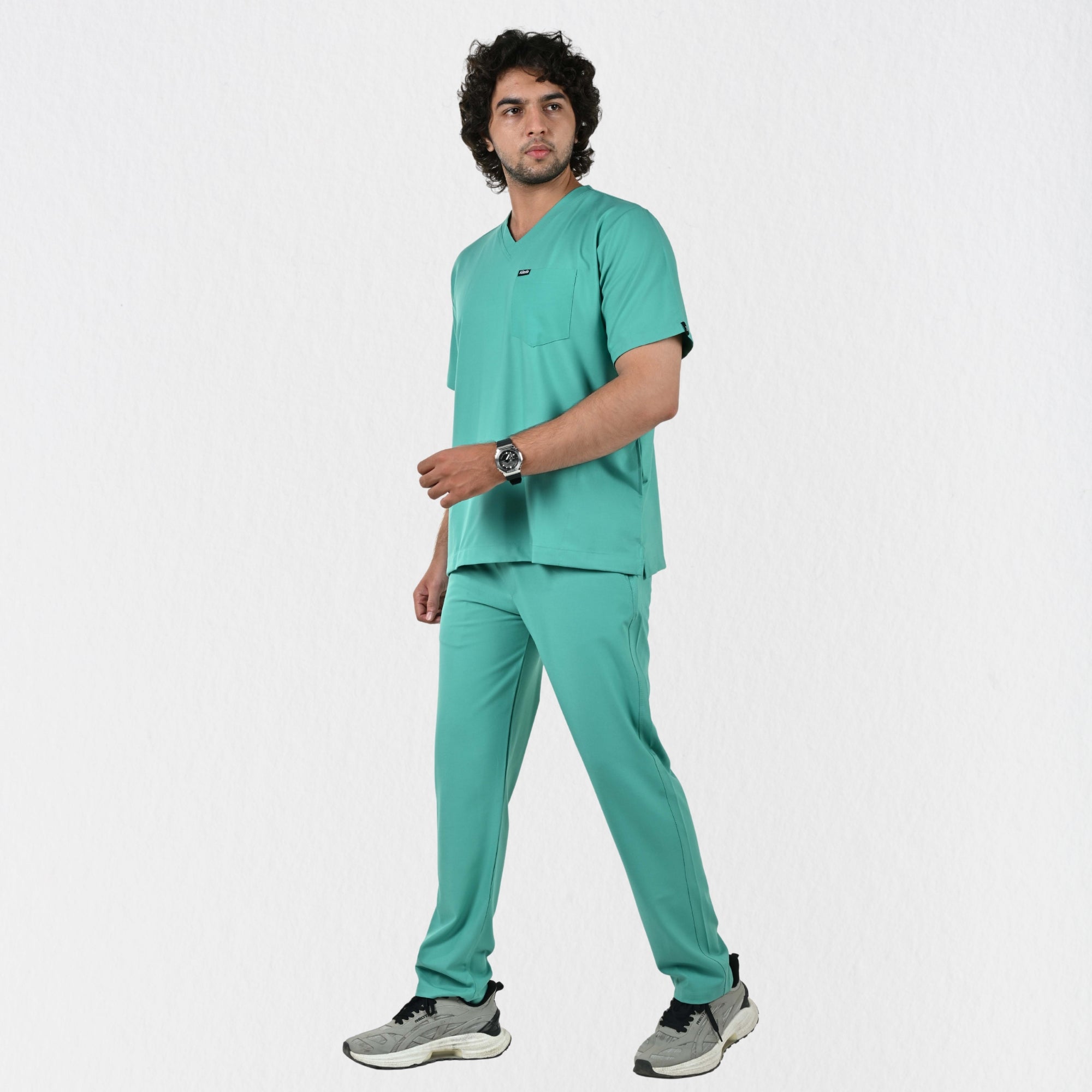 Alleda UltraFlex surgical green scrub fabric close-up — 60% Polyester 34% Rayon 6% Spandex anti-pilling wash-stable classic OT green medical scrub India
UltraflexMenVNeckSGreenScrubSet5.jpg