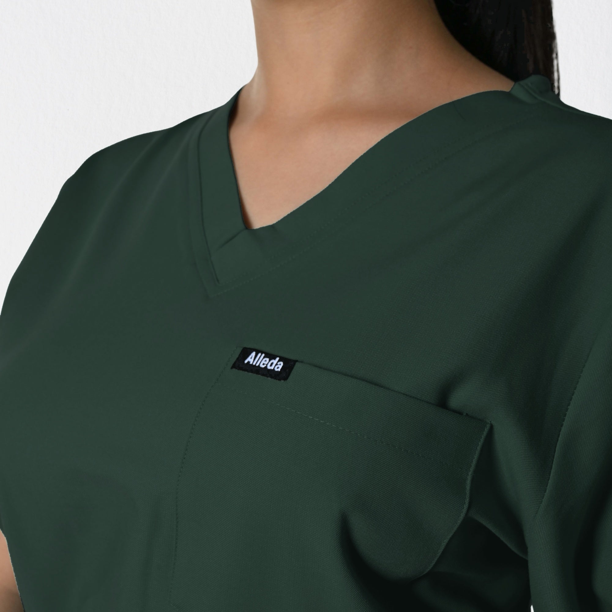 Alleda UltraFlex women's forest green Melaleuca scrub fabric close-up — 60% Polyester 34% Rayon 6% Spandex anti-pilling deep forest green women's clinical workwear India