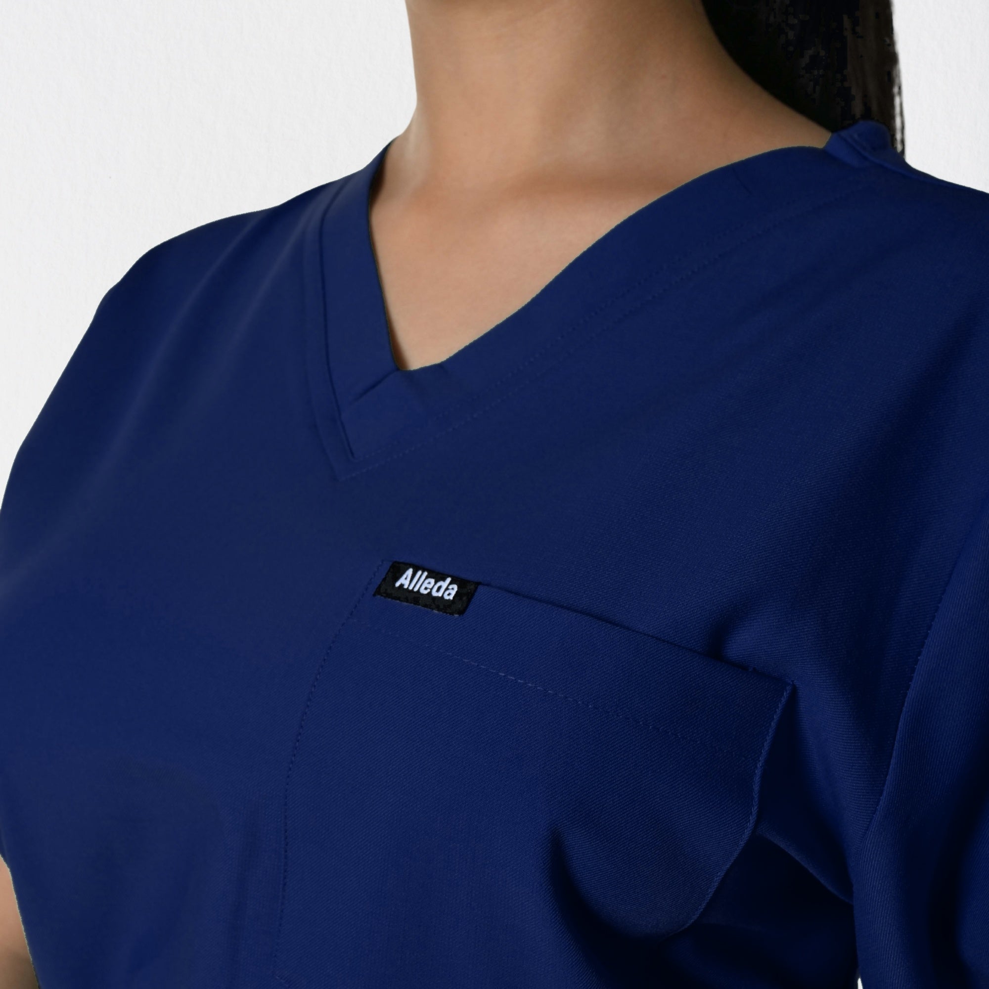 Alleda UltraFlex women's navy blue scrub fabric close-up — 60% Polyester 34% Rayon 6% Spandex anti-pilling women's navy clinical workwear India