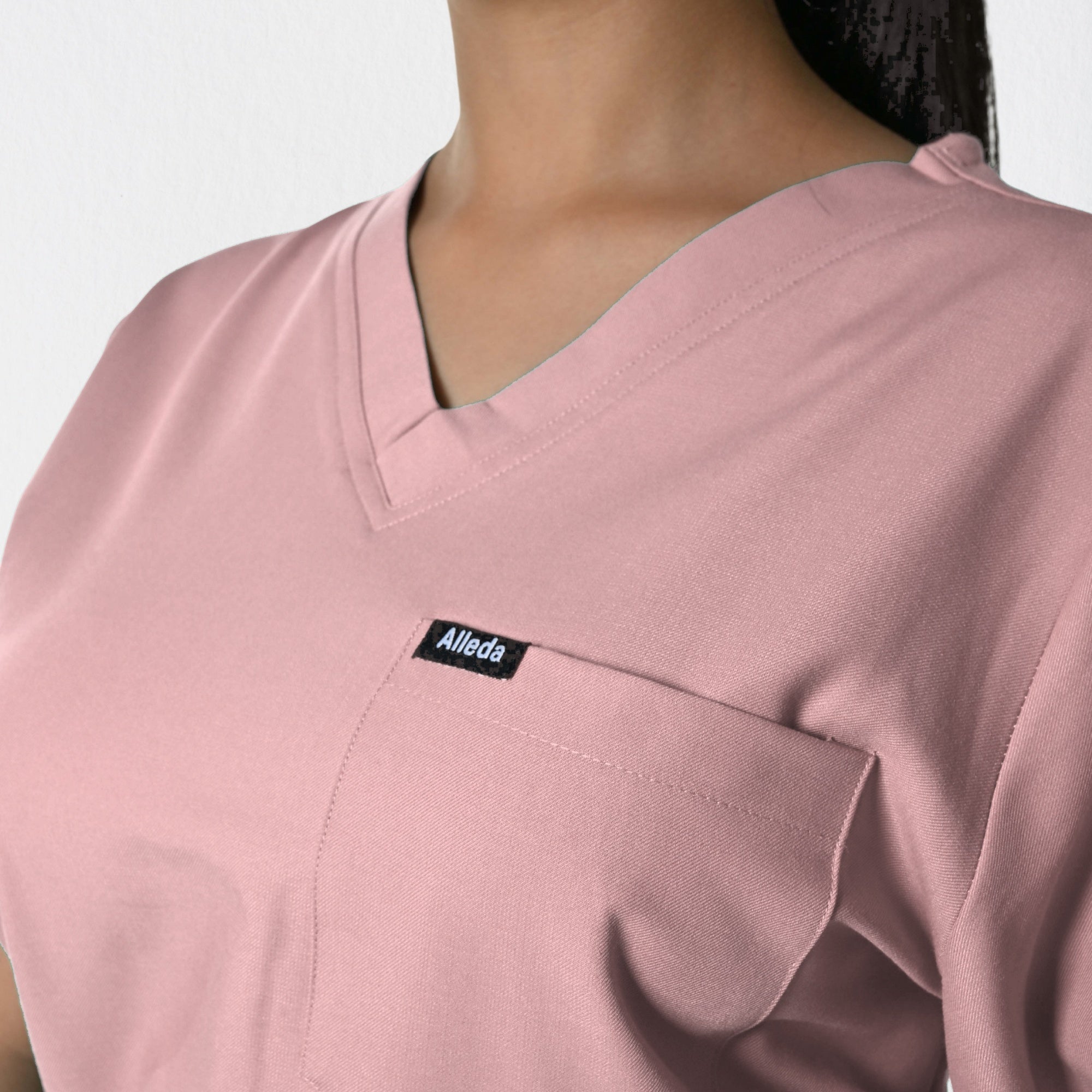 Alleda UltraFlex women's pastel pink rosy touch scrub fabric close-up — 60% Polyester 34% Rayon 6% Spandex anti-pilling soft pink women's medical workwear India