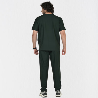 Alleda UltraFlex forest green V-neck scrub top men — chest pocket and neckline detail, premium dark green medical scrubs India