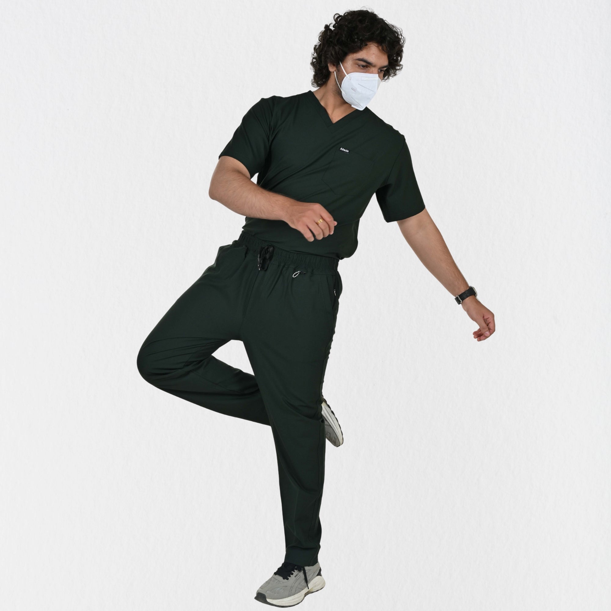 Men's forest green 4-way stretch scrub set side view — unrestricted movement for physiotherapists and doctors, deep green clinical workwear India
