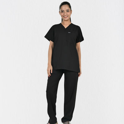 Alleda UltraFlex women's black 4-way stretch V-neck medical scrub set — hero front full-body, independent top bottom sizing, best black scrubs for women doctors India
