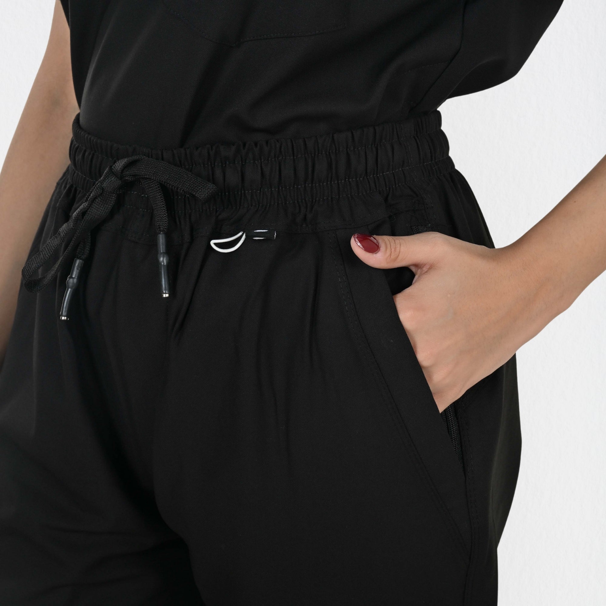 Senior female doctor specialist wearing Alleda UltraFlex black women's medical scrub set — most authoritative black hospital scrubs for women healthcare professionals India
