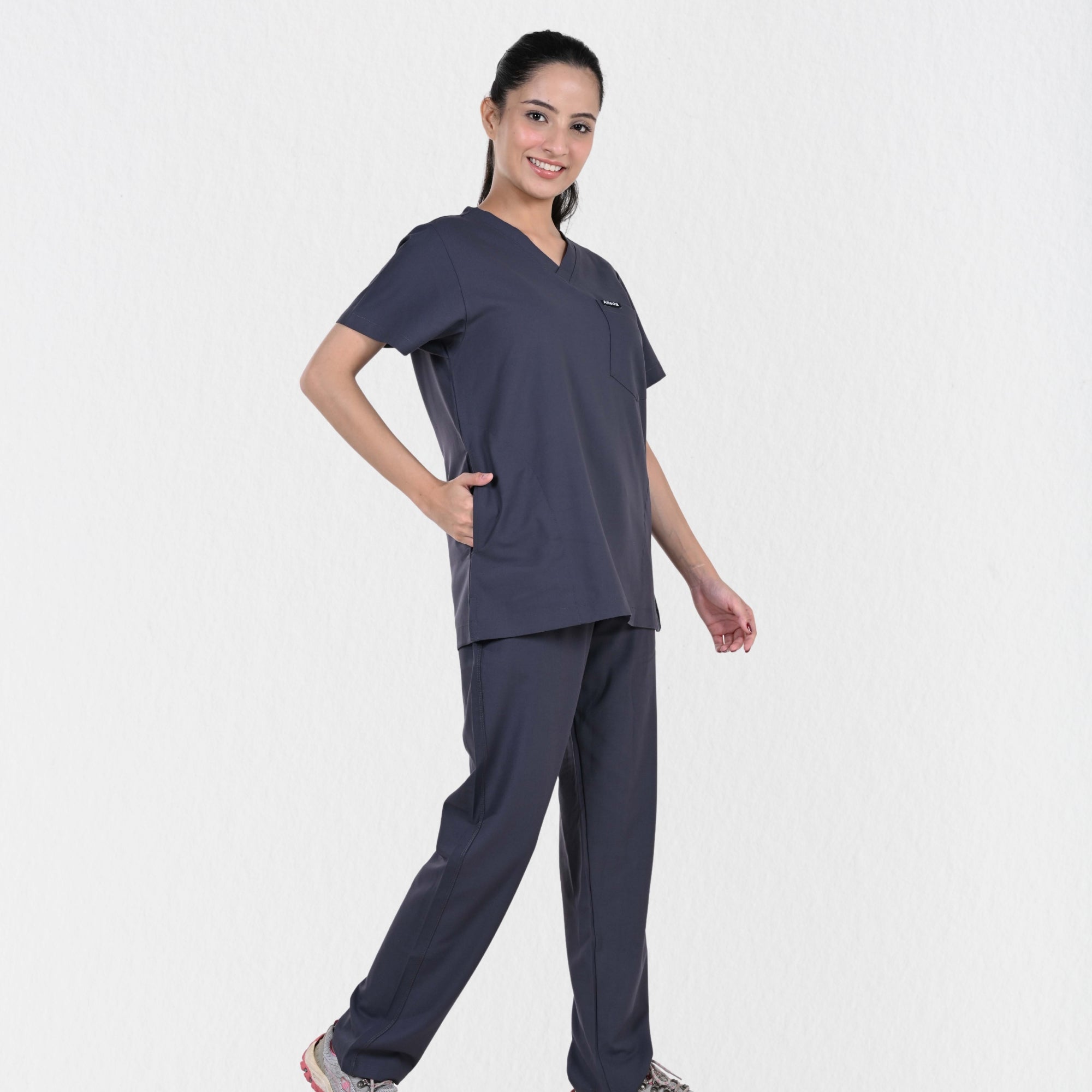 Alleda UltraFlex women's heather grey V-neck scrub top — chest pocket and neckline detail, premium women's grey medical scrubs India
