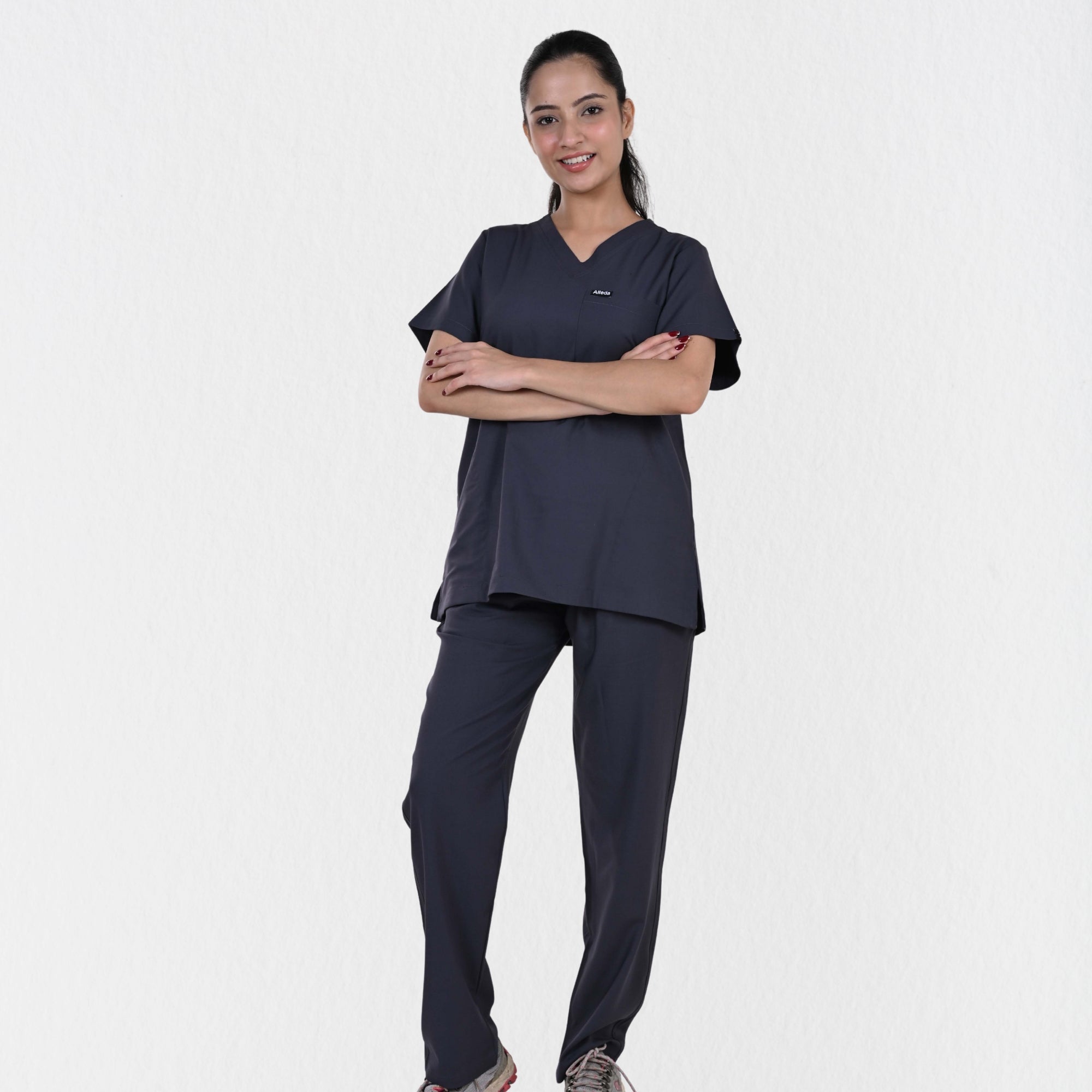 Female doctor physiotherapist wearing Alleda UltraFlex heather grey women's medical scrub set — best grey hospital workwear for women healthcare professionals India
