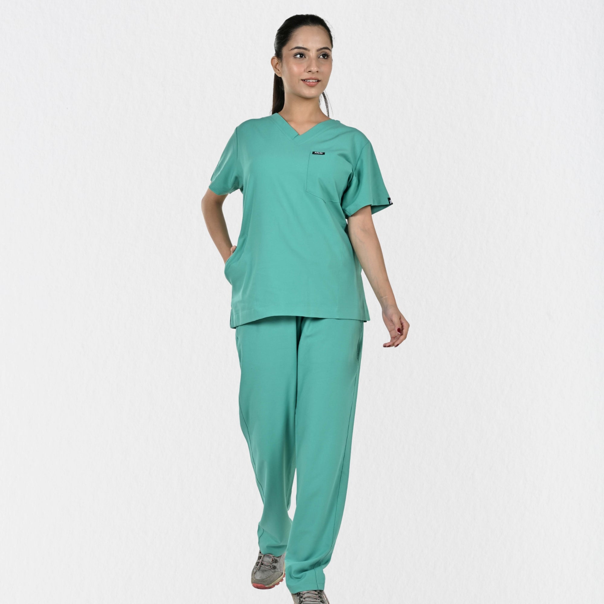 Alleda UltraFlex women's surgical green 4-way stretch V-neck medical scrub set — hero front full-body view, best women's OT scrubs India

