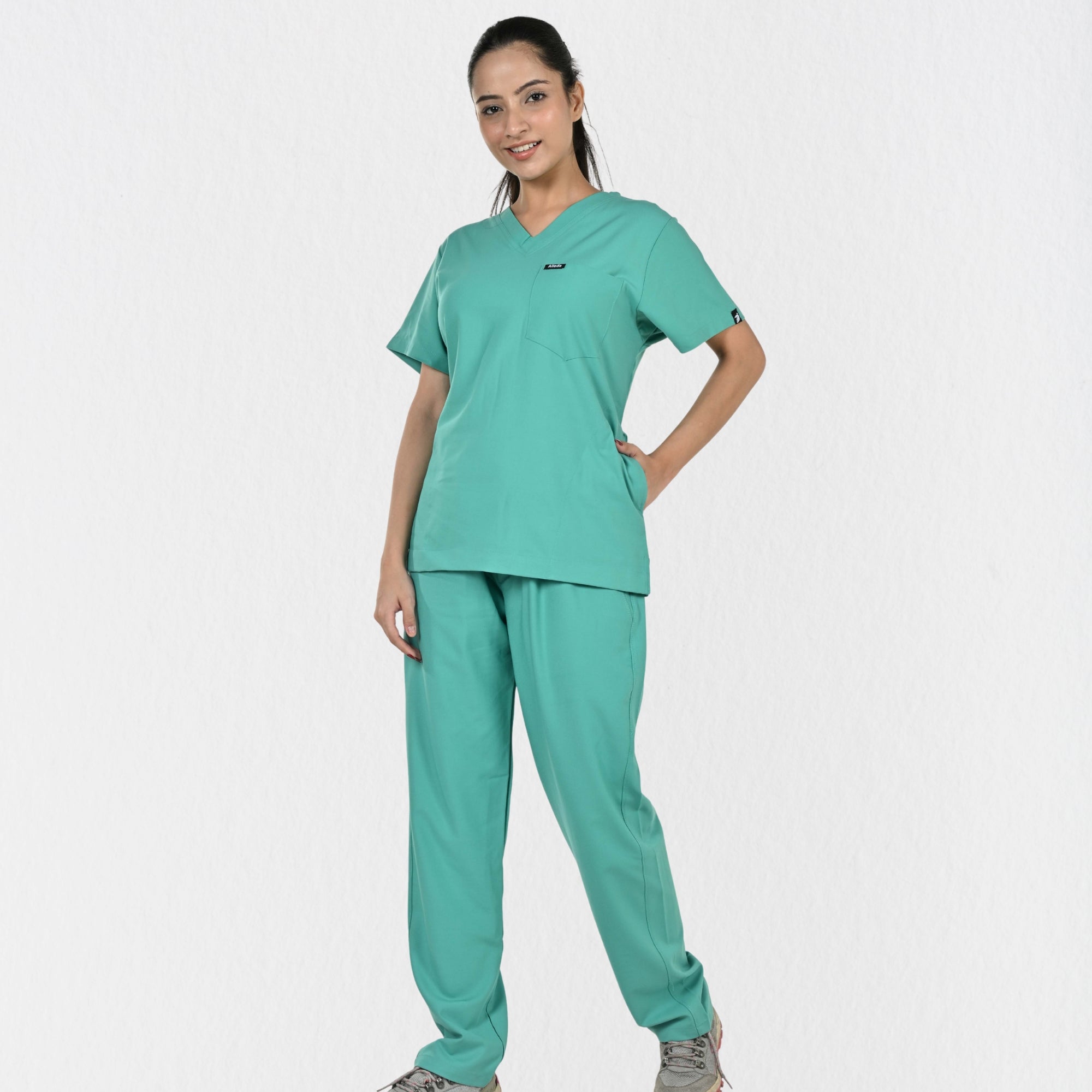 Alleda UltraFlex women's surgical green V-neck scrub top — chest pocket and neckline detail, premium women's surgical green medical scrubs India
