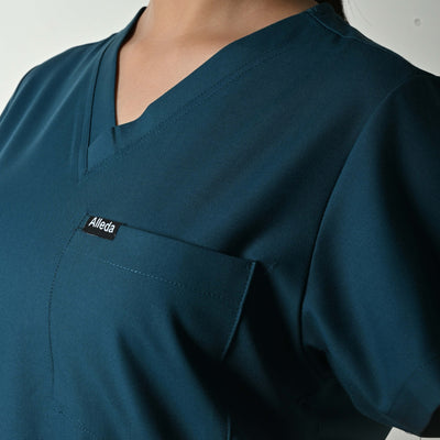 Alleda UltraFlex women's teal scrub fabric close-up — 60% Polyester 34% Rayon 6% Spandex anti-pilling teal women's clinical workwear flattering Indian skin tones
