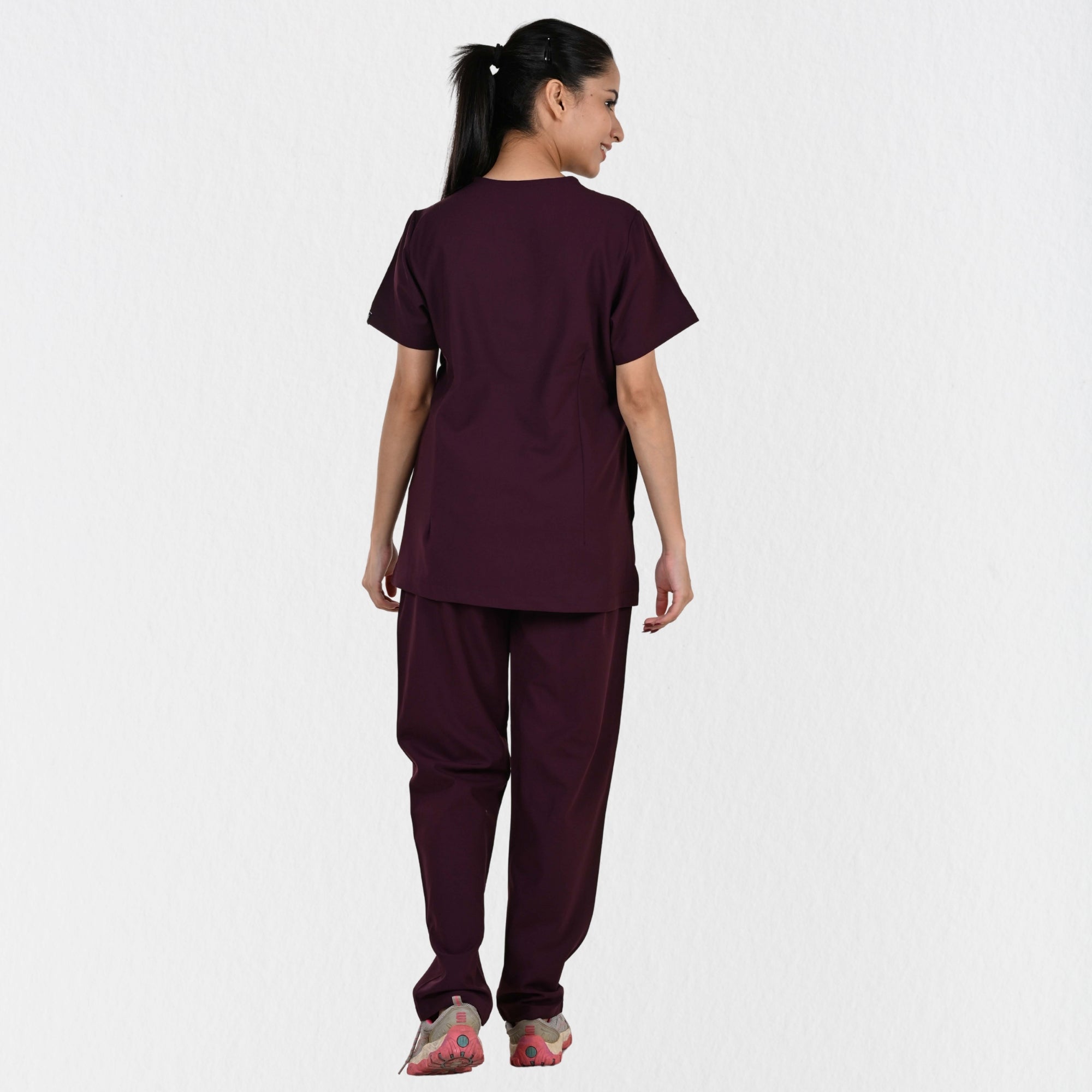 Women's wine 4-way stretch scrub set side view — tailored fit for female doctors physiotherapists, wine clinical workwear independent sizing India
