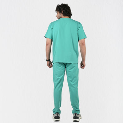 Alleda UltraFlex surgical green V-neck scrub top men — chest pocket and neckline detail, premium surgical scrubs for doctors India