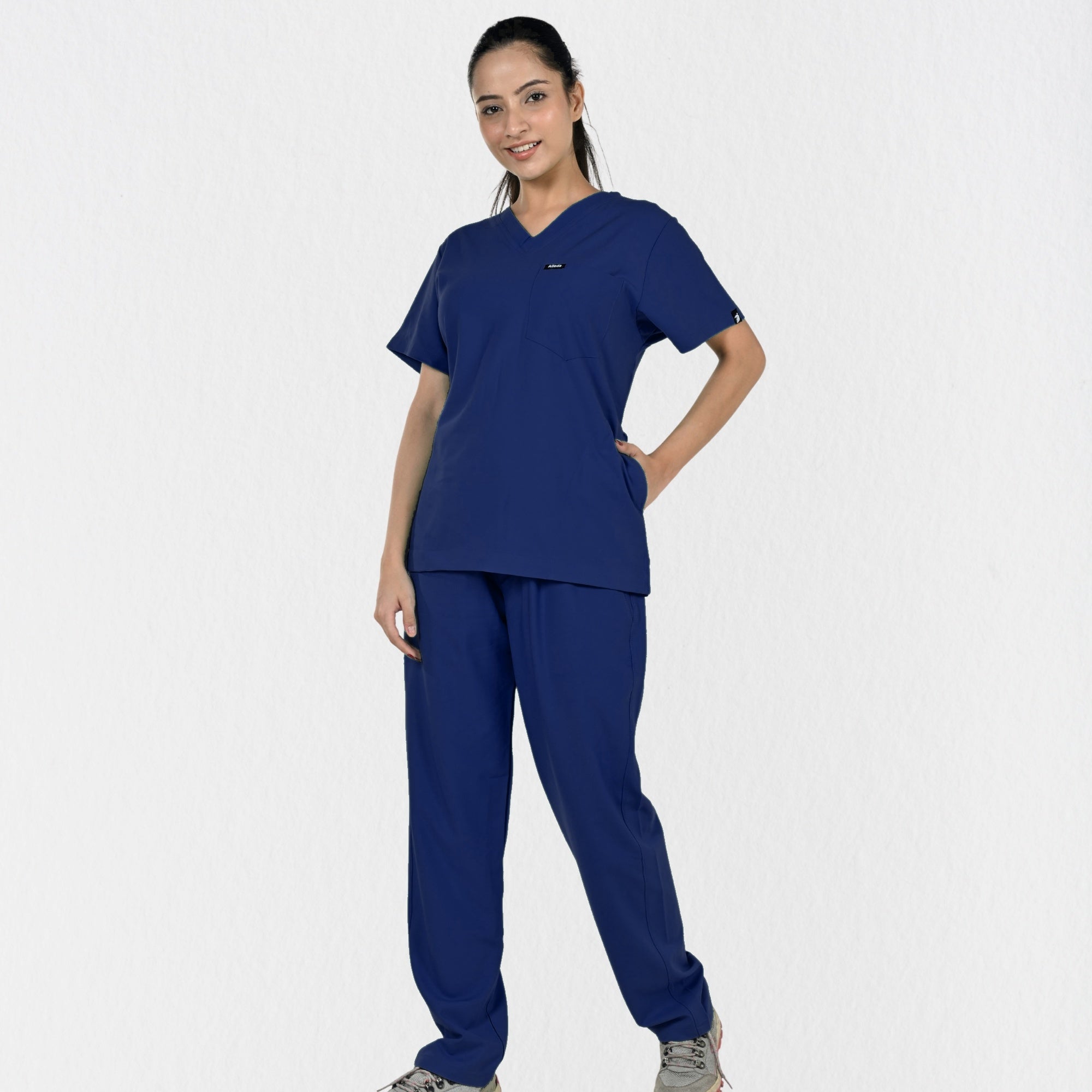 Alleda UltraFlex women's navy blue V-neck scrub top — chest pocket and neckline detail, premium women's navy medical scrubs independent sizing India
