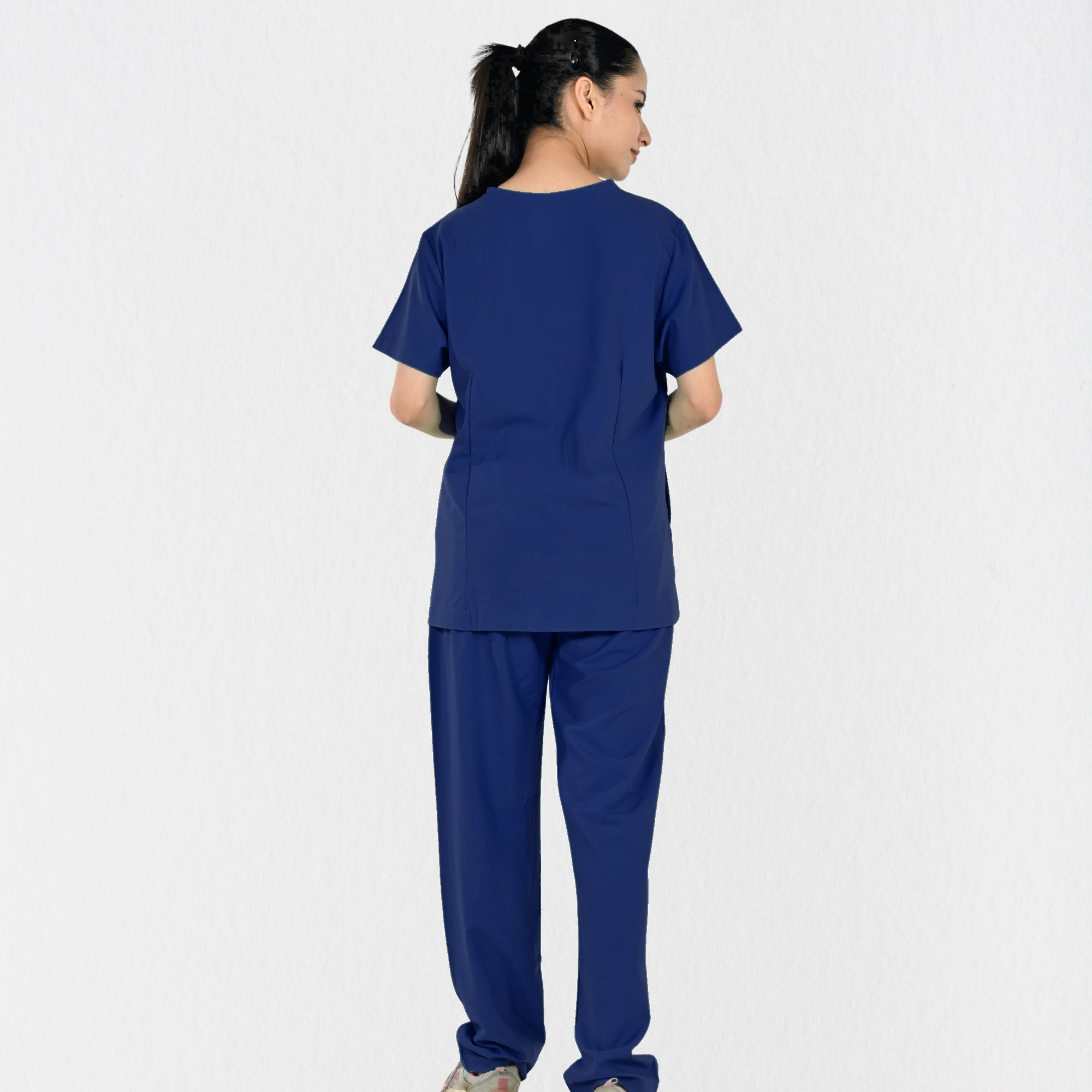 Women's navy blue 4-way stretch scrub set side view — tailored fit for female doctors physiotherapists, independent sizing navy clinical workwear India
