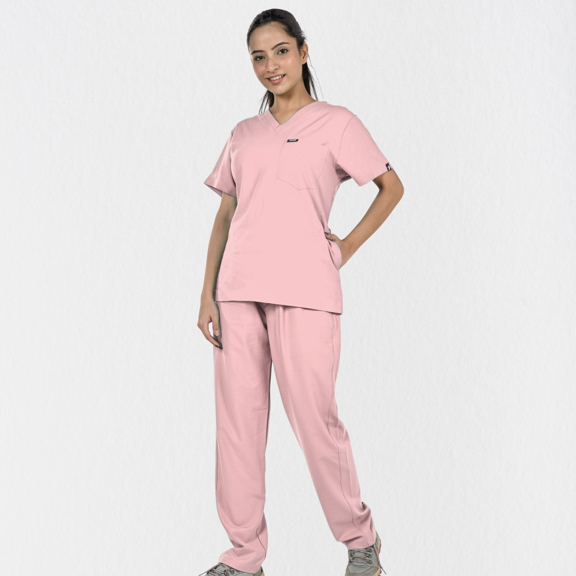Alleda UltraFlex women's pastel pink rosy touch V-neck scrub top — chest pocket and neckline detail, premium women's pink medical scrubs India