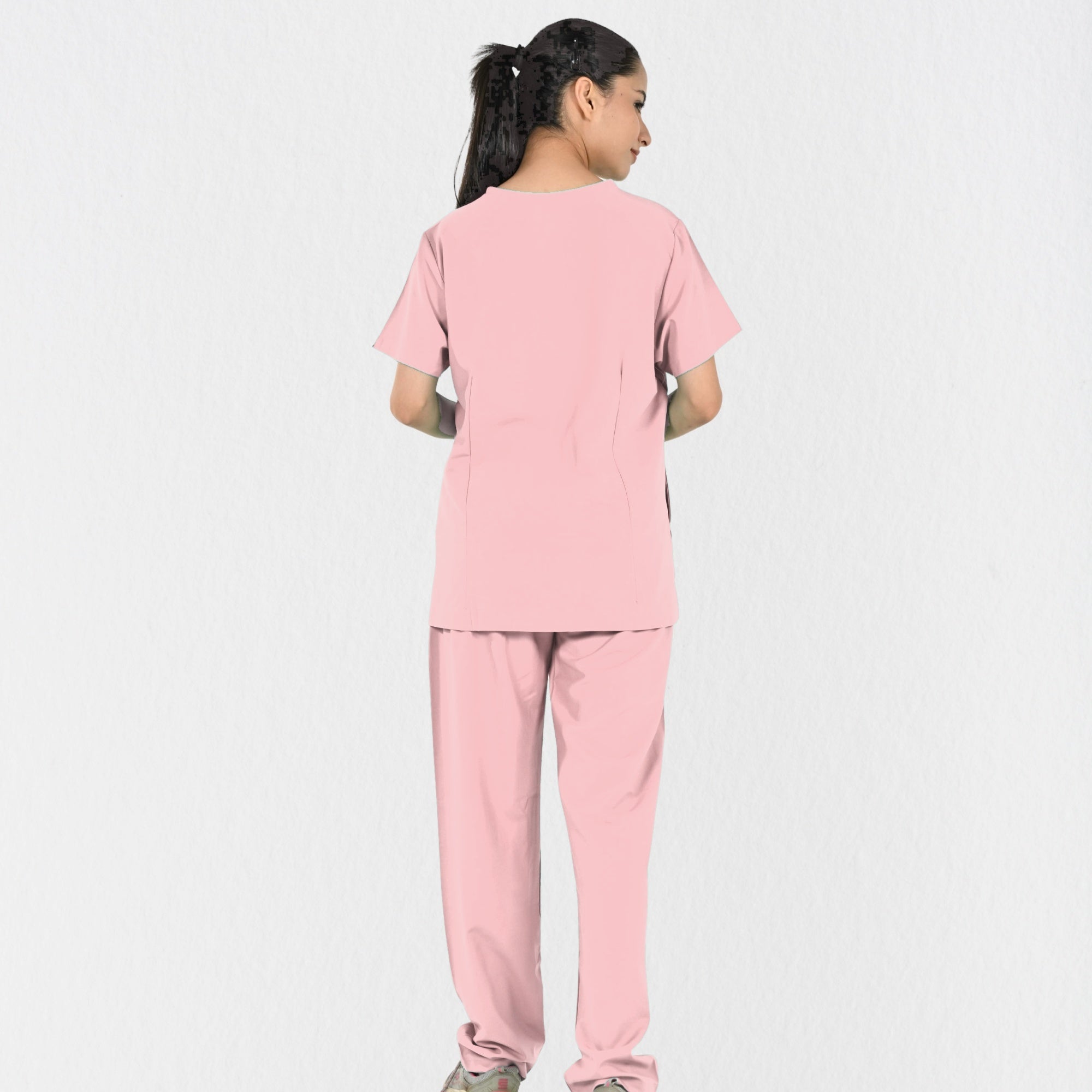 Women's pastel pink 4-way stretch scrub set side view — tailored fit for female doctors and paediatricians, women's exclusive pink clinical workwear India