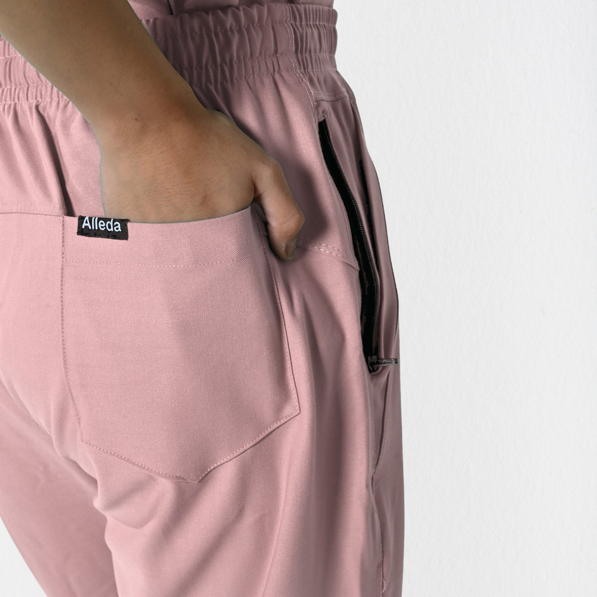 Alleda UltraFlex women's pastel pink 8-pocket scrub set detail — women's exclusive rosy touch clinical uniform, best pink scrubs for female doctors India
